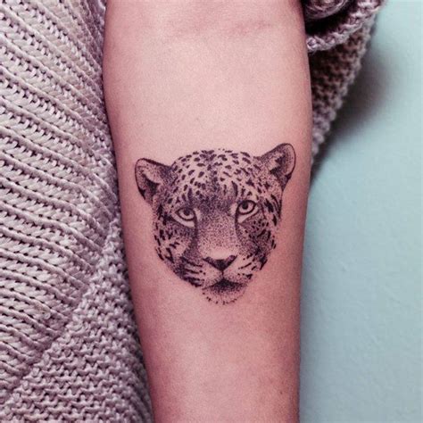 leopard face tattoo.